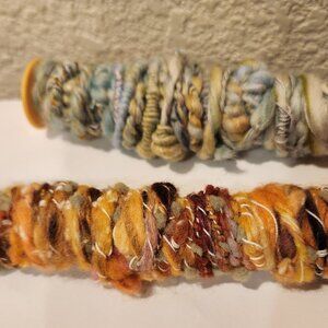 New, handmade art yarn, super soft wool. 6 yards per bobbin.